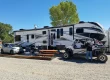 Fifth-wheel RV at a Windhaven RV Resort campsite